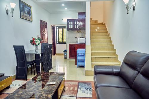 a living room with a couch and a table at SERENITY Flat3 in Pointe-Noire