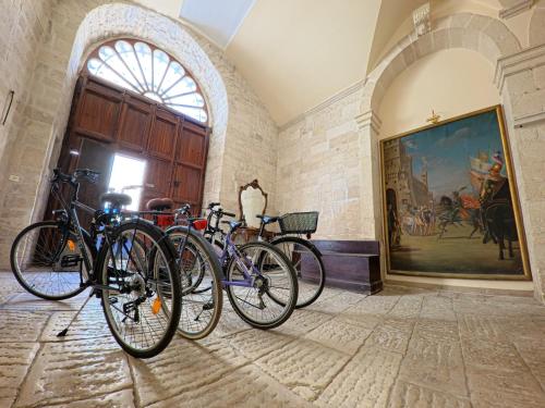 a group of bikes parked in a room at Palazzo Framarino dei Malatesta - Noble Floor - XIV Century in Giovinazzo
