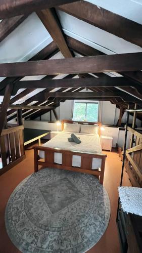 a bedroom with a large bed in a attic at Southside Getaway in Margaret River Town