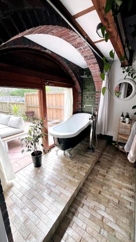 a bathroom with a bath tub in a room at Southside Getaway in Margaret River Town