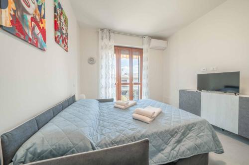 Postel nebo postele na pokoji v ubytování Marilyn - Modern and Cozy Apartment