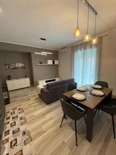 a living room with a table and a couch at Casa Flavia in Bracciano