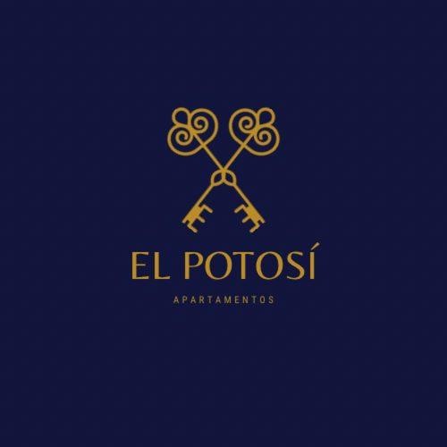 un logo d’oro con forbici incrociate su sfondo blu di Apartamento La Panaderia a Montijo
