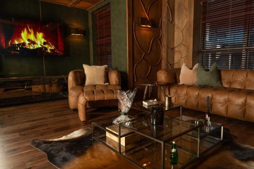 a living room with a couch and a fireplace at Suites By Le Rêve in Tangier