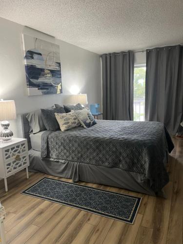 a bedroom with a bed and a window at Marazul in Cape Coral