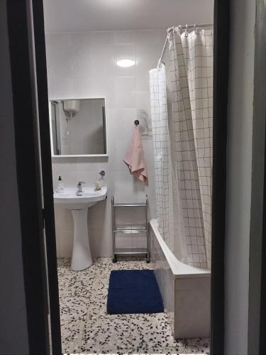 a bathroom with a sink and a tub and a shower at CASA ANTONIO Y GABI Ruta de los dinosaurios in Igea