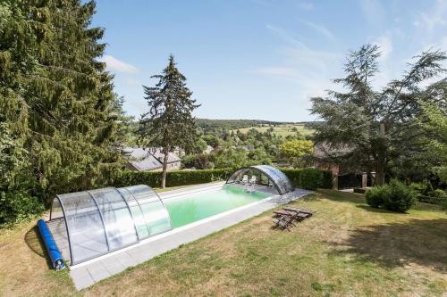 an image of a swimming pool in a house at La Délice in Érezée