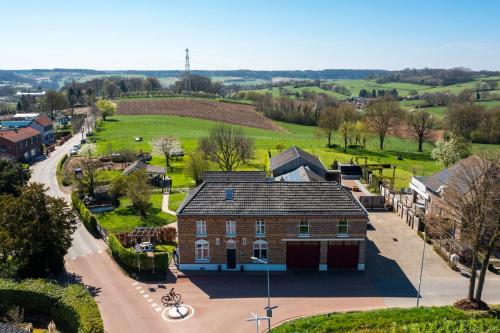 an aerial view of a large brick house at Op de koule in Klimmen