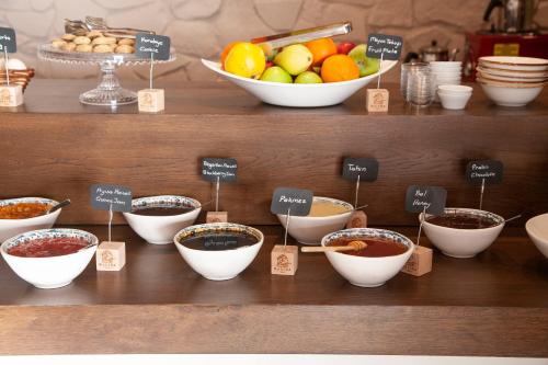 a display of bowls of food on a shelf at Datca Sapphire Hotel in Datca