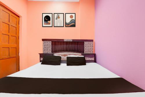 Postel nebo postele na pokoji v ubytování Hotel O SK Grand