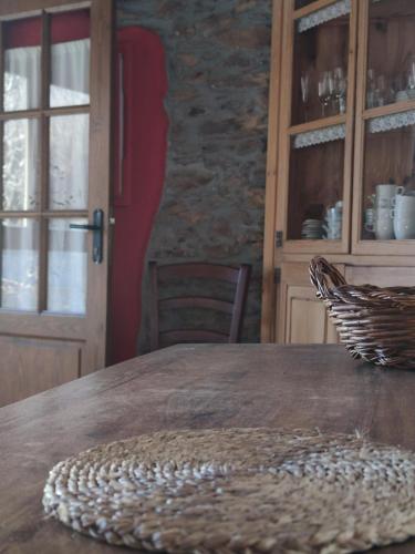 a wooden table with a basket on top of it at CASA JAN, Casa Rural en Beraní in Beraní