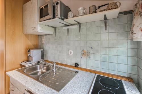 A kitchen or kitchenette at Rooms Zupančič