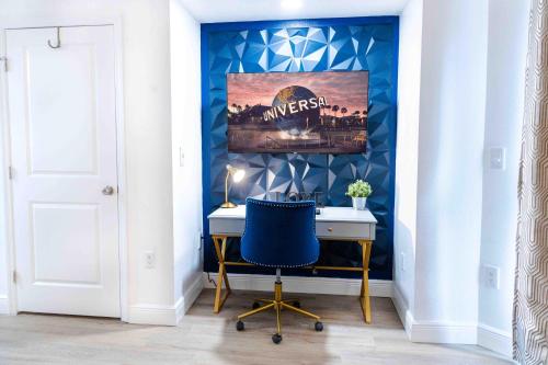 a desk with a blue chair in a room at Luxury Lakeview Getaway 1 mile Universal Studios in Orlando
