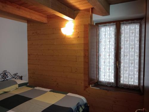 Ένα ή περισσότερα κρεβάτια σε δωμάτιο στο Casa Meli