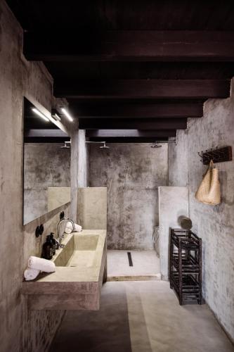 a large bathroom with a sink and a mirror at Finca Legado Ibiza in Santa Eularia des Riu