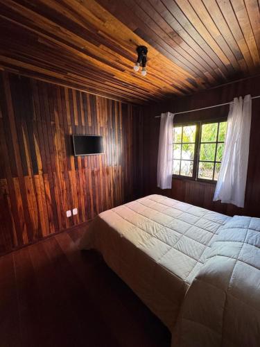 Ein Bett oder Betten in einem Zimmer der Unterkunft Pousada Pinheiro Real