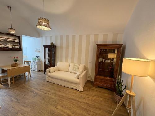 a living room with a chair and a table at Ca' Bela in Dolceacqua