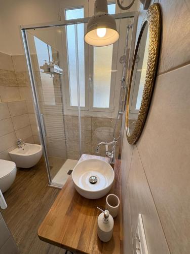 a bathroom with a sink and a shower at Ca' Bela in Dolceacqua