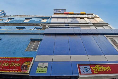 a blue building with signs on the side of it at Hotel O Star View in Kolkata