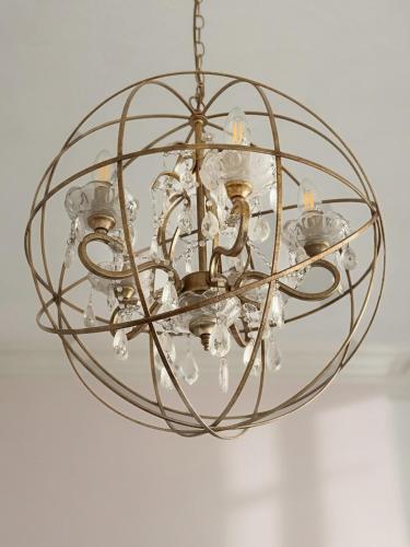 a glass orb chandelier hanging from a ceiling at Verulam Palms - Private Garden & Parking in Bournemouth
