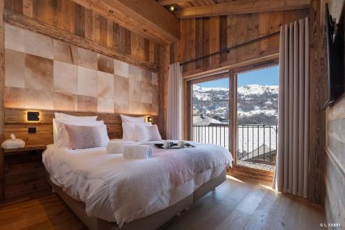 En eller flere senge i et værelse på Alpine View