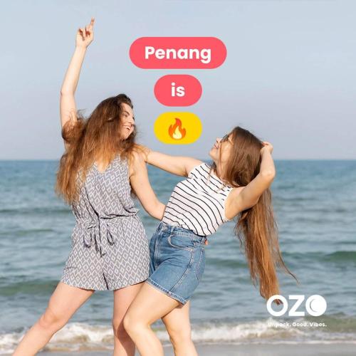 two girls in shorts playing on the beach at Sri sayang pearl view in Batu Ferringhi