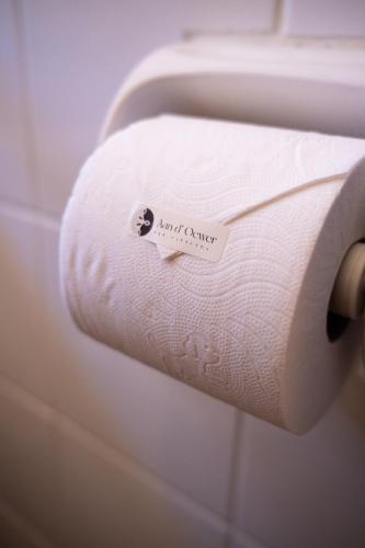 a roll of toilet paper with a sticker on it at Aan d'Oewer in Citrusdal