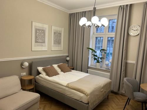Ένα ή περισσότερα κρεβάτια σε δωμάτιο στο Apartament Przy Operze