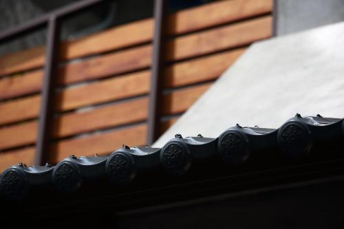 a close up of a black railing next to a building at Ttdropin Homestay in Taitung City