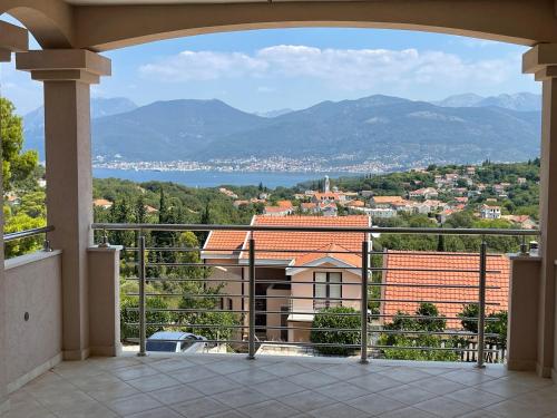 a view of a city from a balcony at Apartments Amilija in Radovići