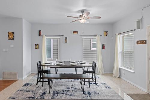 a dining room with a table and a ceiling fan at Near Downtown Heights Apt Yard Terrace WiFi Desk in Houston