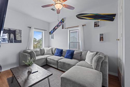 a living room with a couch and a table at Near Downtown Heights Apt Yard Terrace WiFi Desk in Houston