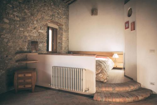 Ένα ή περισσότερα κρεβάτια σε δωμάτιο στο Antico casale per relax e natura
