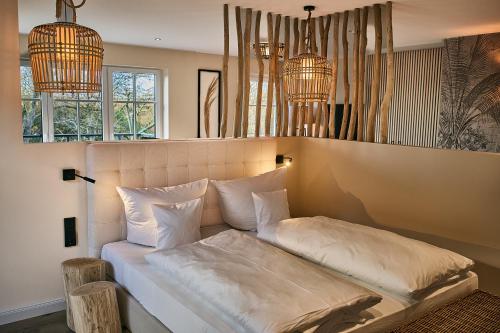 Postel nebo postele na pokoji v ubytování Das Oswald's Boutique Hotel