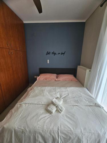 a bedroom with a bed with a teddy bear on it at Rest & Nest Luxury Apartment in Perea