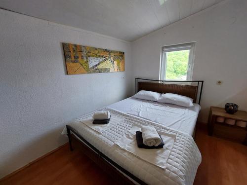 Postel nebo postele na pokoji v ubytování Apartment Ester