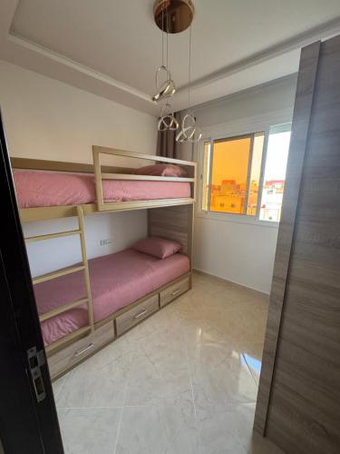 Postel nebo postele na pokoji v ubytování Tamuda Bay Family Appartement