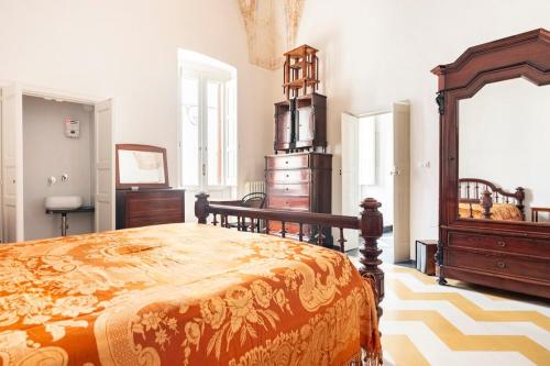 Postel nebo postele na pokoji v ubytování Casa dell'Arciprete Dimora storica