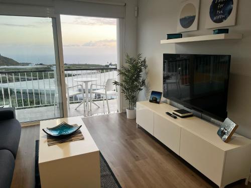 TV a/nebo společenská místnost v ubytování Lainara Sunset