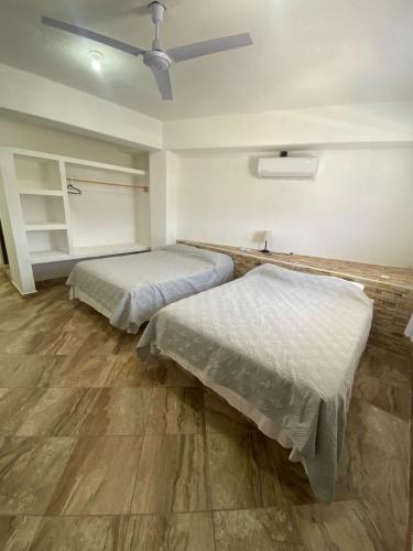 Katil atau katil-katil dalam bilik di Hotel Rincón Madera