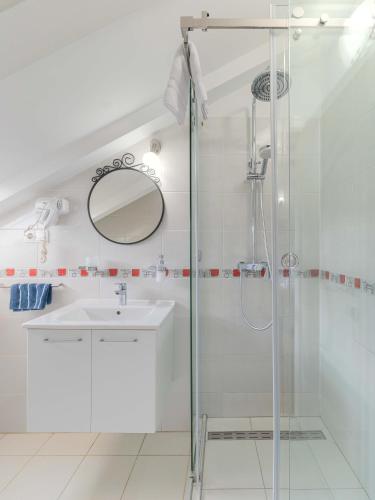 a bathroom with a sink and a shower at Apartment The Charm in Split
