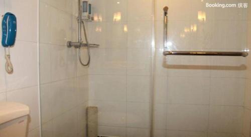 a bathroom with a shower and a toilet at Jinling Mansion Nanjing in Nanjing