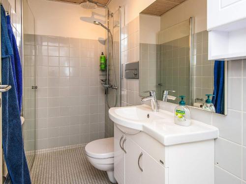 a bathroom with a sink and a toilet at 4 person holiday home in Lemvig in Lemvig