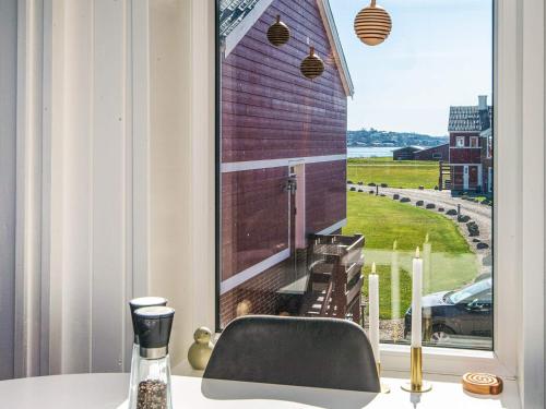 a room with a window with a table and a chair at 4 person holiday home in Lemvig in Lemvig