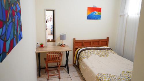 Ένα ή περισσότερα κρεβάτια σε δωμάτιο στο Casa Buenas Olas a 5 minutos