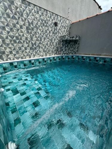 Πισίνα στο ή κοντά στο Casa em Itanhaém com Piscina Alto Padrão Próximo da Praia