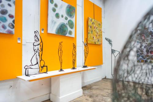 a room with colorful paintings on the walls at LUXURY PET-FRIENDLY's BENDIGO ACCOMMODATION 4 BEDROOM 2 BATHROOMS ENTIRE HOME WALK TO BENDIGO CBD LAKE EASTER FESTIVAL Bendigo Regional Tennis Centre BRTC Central Deborah Gold Mine Bendigo Art Gallery Golden Dragon Museum Rosalind Park The Great Stupa in Bendigo