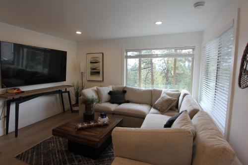 a living room with a couch and a tv at LVC0615 - Lake Therapy condo in Zephyr Cove