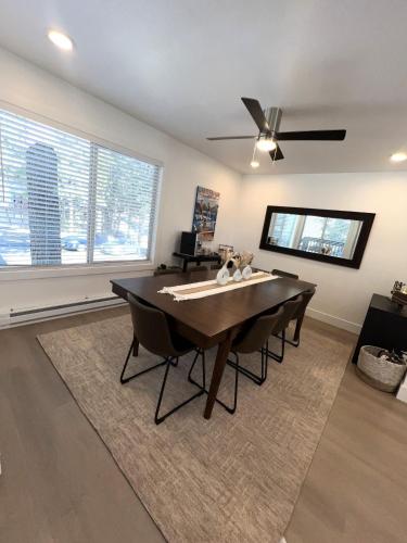 a dining room with a table and a ceiling fan at LVC0615 - Lake Therapy condo in Zephyr Cove