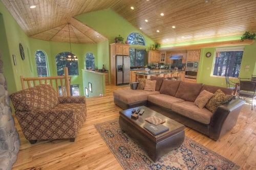 a living room with a couch and a table at COH1669 - Hawk's View Hideaway home in South Lake Tahoe